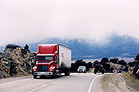 /images/133/2006-01-buena-vista-truck.jpg - #02660: red Semi Truck leaving Buena Vista towards Fairplay … Jan 2006 -- Buena Vista, Colorado