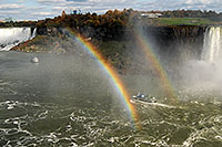 /images/133/2006-10-15-niag-rainbow01.jpg - #03029: boat within double rainbow heading from Canadian Falls (right) to US Falls (left) … Oct 2006 -- Niagara Falls, Ontario.Canada