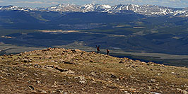 /images/133/2007-06-10-elbert-skier1-pano.jpg - #03894: Skier and hiker with dogs  walking up the North Trail of Mt Elbert, Colorado