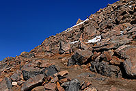 /images/133/2007-06-17-evans-hike-up.jpg - #03944: hiker walking uphill along Mt Evans trail from 14,133 ft parking lot to 14,264 summit  … June 2007 -- Mt Evans, Colorado
