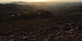 /images/133/2007-06-30-evans-sun-road-pano.jpg - #04110: Morning Silhouettes of mountains and parked cars along Mount Evans Road  … June 2007 -- Mt Evans, Colorado