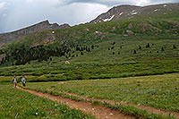 /images/133/2007-07-07-biers-hikers01.jpg - 04146: Hikers returning from Mt Bierstadt (14,060 ft, on the right) … The Sawtooth (13,780 ft, on the left) … July 2007 -- The Sawtooth, Mt Bierstadt, Colorado