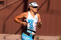 /images/133/2011-10-23-soma-run-108493.jpg - #09639: 03:13:23 #1 Lead Female running at Soma Triathlon 2011 - Go Go Baby on her hand … October 2011 -- Tempe, Arizona