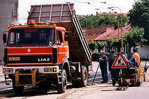 red Liaz construction truck and workers in Kosice