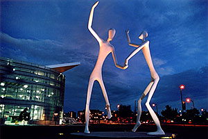 Denver Figures at twilight (by Performing Arts Center)