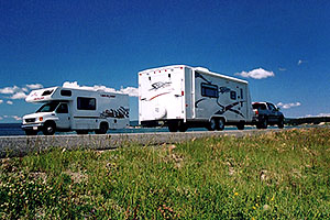 motorhomes with Yellowstone Lake in the background