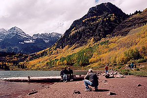 People at Maroon Lake with Maroon Peaks in the background