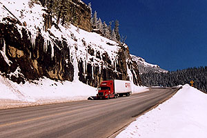red Semi Truck going down Wolf Creek Pass towards Durango