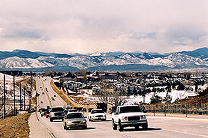 Cars in Highlands Ranch with western mountains in the background