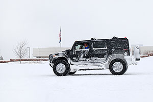 black Hummer H2 during December snowstorm