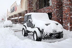 Jeep Wrangler by Safeway during December snowstorm