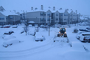 snowplow and cars during a December snowstorm