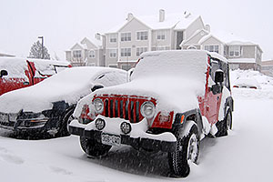 red Jeep Wrangler at Remington during December snowstorm