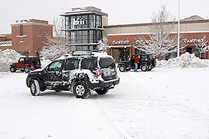 Xterra and and red and blue Jeep Wranglers in front of REI #61 in Englewood, Colorado