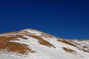 moon over summit of east face of Loveland Pass