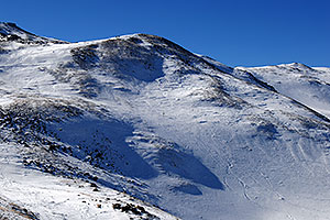 skiers walking up west face of Loveland Pass