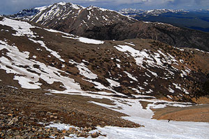Skier skiing down Mt Elbert â€¦ view of Mt Massive at 14,421 ft