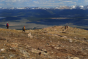 Skier and hiker with dogs  walking up the North Trail of Mt Elbert, Colorado