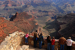 Girl in pink and people enjoying views from Lookout Studio in Grand Canyon