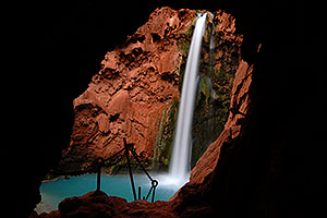 View of Mooney Falls - 210 ft drop (64 meters) - from one of two caves along a steep vertical trail with chains
