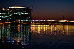 8 person sculling boat at Tempe Town Lake under a crescent moon