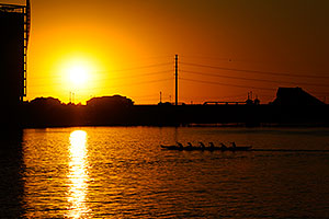 Canoeists during sunset at North Bank Boat Ramp at Tempe Town Lake