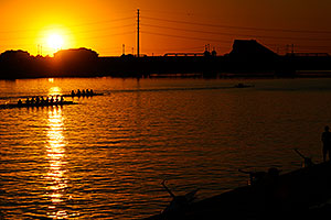 8 scull and 4 scull boats at sunset at the docks of North Bank Boat Ramp at Tempe Town Lake