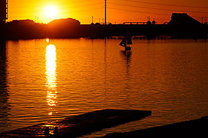 Sailboat at sunset at North Bank Boat Ramp at Tempe Town Lake