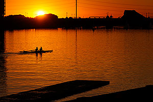 Scullers at sunset at North Bank Boat Ramp at Tempe Town Lake