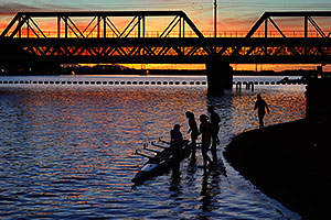 Scullers at sunset on North Bank Boat Beach at Tempe Town Lake