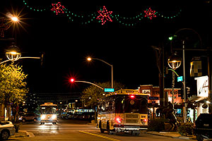 Trolley busses at night at Scottsdale Road and Main St