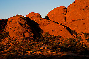 Ramada by the Buttes of Papago Park and a hiker on top
