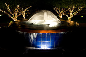 Fountain in a park by Arizona Center at night in Phoenix