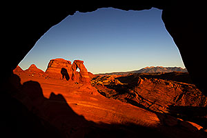 View of Delicate Arch through a window in Arches National Park
