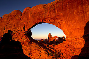 Photographer Silhouette and Turret Arch through North Window in Arches National Park