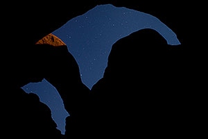 Moonlit rocks and sky of Double Arch in Arches National Park