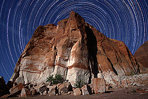 3.5 hours of star trails above a rock at Lake Powell