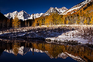 Snowy Pond reflection of Maroon Bells, Colorado