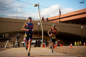 06:45:04 - #34 Paul Amey [USA] (on the right) in the lead (eventually 2nd) in Lap 2, ahead by a lap of #29 Douglas MacLean [USA] (eventually 34th) - Ironman Arizona 2011