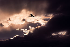 Plane and angry sky clouds