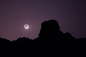 Mountain silhouettes and crescent moon in Superstitions