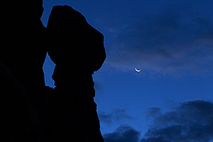 Crescent Moon in Arches National Park before sunrise