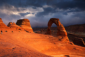 People at Delicate Arch in Arches National Park