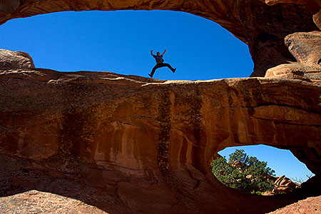 Frog jumping at Double O Arch in Arches National Park 