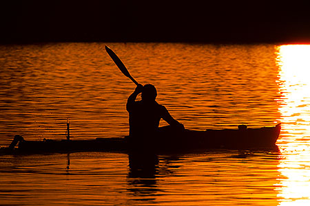 Kayaker at sunset at Tempe Town Lake 