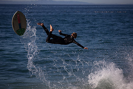 Skimboarders at Aliso Beach, California 