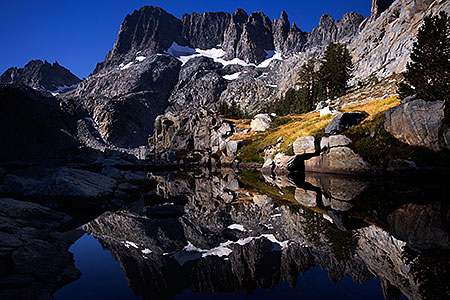 Minarets reflecting in Iceberg Lake in Eastern Sierra, California 